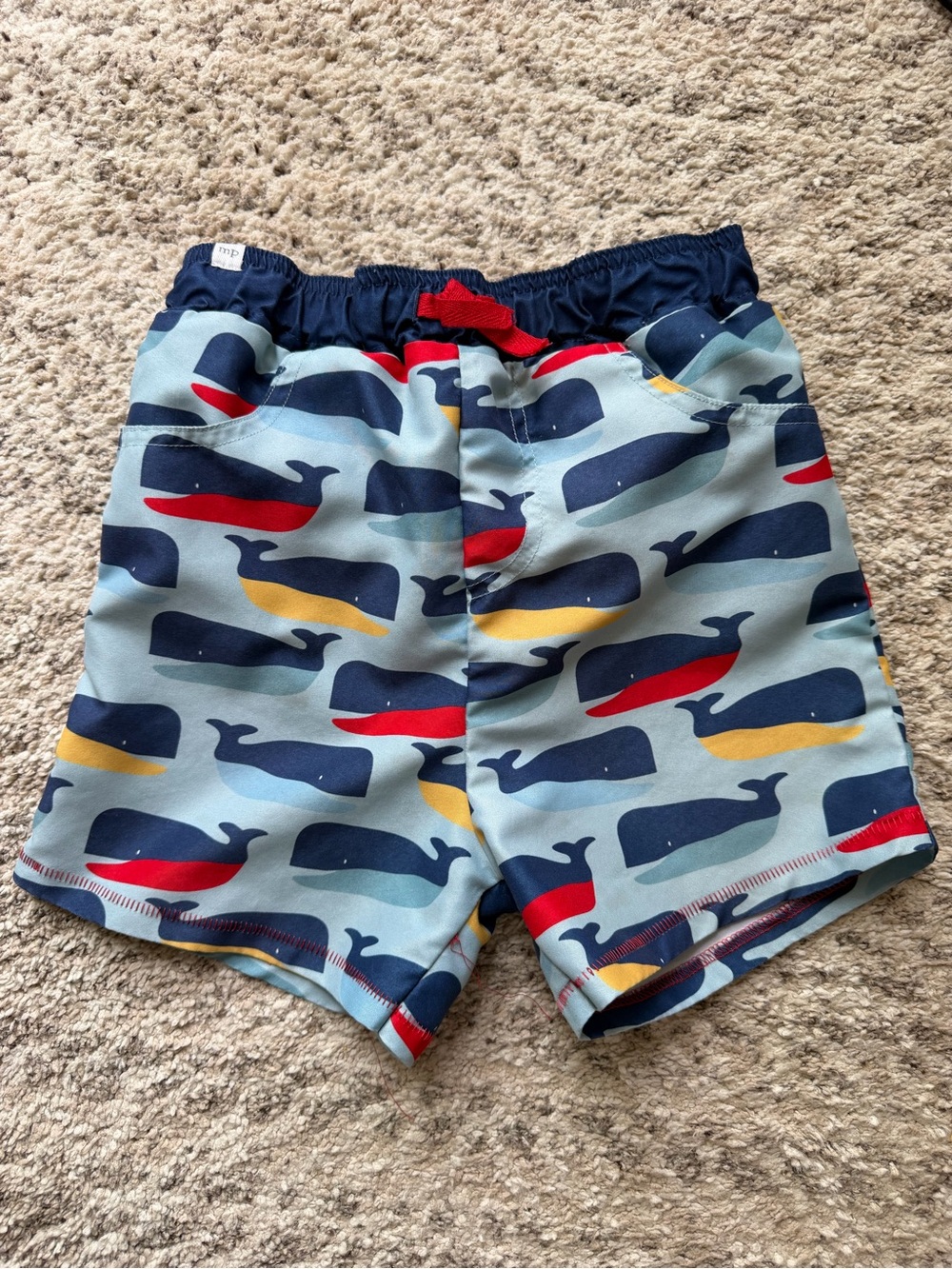 Mud Pie Boys Light Blue Whale Print Swim Shorts with Navy, Red & Yellow Accents